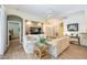 Comfortable living room with a media center, neutral walls, and wood-look floors create a cozy atmosphere at 706 Misty Pond Ct, Bradenton, FL 34212