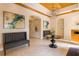 Inviting lobby area with tiled floor, tufted benches, arched doorways, and elegant lighting at 706 Misty Pond Ct, Bradenton, FL 34212