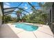 A stunning screened-in pool area with an attached spa, providing a perfect outdoor relaxation space at 706 Misty Pond Ct, Bradenton, FL 34212