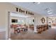 Open view of The Bistro area with tables, chairs, televisions and access to an outside view at 706 Misty Pond Ct, Bradenton, FL 34212