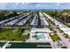 Aerial view showcases a waterfront community, pool, and marina with ocean access and nearby beaches at 730 Spanish S Dr # 99, Longboat Key, FL 34228