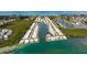 Aerial view of a waterfront community, with homes lining canals, showcasing the coastal lifestyle at 730 Spanish S Dr # 99, Longboat Key, FL 34228