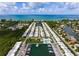 Coastal community aerial view with marina, canal, and beach access at 730 Spanish S Dr # 99, Longboat Key, FL 34228