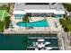 Aerial view of pool and marina offers a waterfront community with boat access and resort-style amenities at 730 Spanish S Dr # 99, Longboat Key, FL 34228