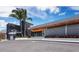 Shore Restaurant featuring a contemporary building design with a palm tree and geometric wall pattern at 730 Spanish S Dr # 99, Longboat Key, FL 34228