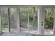 Sliding glass doors let in plenty of light and provide access to lush outdoor patio at 730 Spanish S Dr # 99, Longboat Key, FL 34228