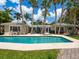 Spacious backyard pool with surrounding patio, perfect for outdoor relaxation and entertainment at 7614 Peninsular Dr, Sarasota, FL 34231