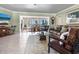 Spacious living room with waterfront views and tiled flooring at 7614 Peninsular Dr, Sarasota, FL 34231