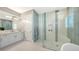 Modern bathroom featuring a walk-in shower, and a quartz topped vanity at 7838 Bowspirit Way, Lakewood Ranch, FL 34202