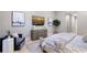 Comfortable bedroom features stylish decor, neutral paint, wood floors and modern furniture at 7838 Bowspirit Way, Lakewood Ranch, FL 34202