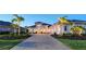 Beautifully landscaped home with a paved driveway and three-car garage at 7838 Bowspirit Way, Lakewood Ranch, FL 34202