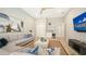 Relaxing living room showcases a large sectional sofa, modern decor, wet bar, and a wall-mounted television at 7838 Bowspirit Way, Lakewood Ranch, FL 34202