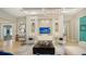 Contemporary living room showcasing elegant decor and recessed lighting at 7838 Bowspirit Way, Lakewood Ranch, FL 34202