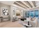 Bright and airy living room with modern furnishings and a view of the pool at 7838 Bowspirit Way, Lakewood Ranch, FL 34202
