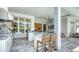 Entertaining outdoor kitchen with bar, seating, and grill with easy access to the cozy patio seating area at 7838 Bowspirit Way, Lakewood Ranch, FL 34202