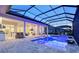 An expansive outdoor living space featuring a pool, spa, and a seamless transition to indoor comforts at 7838 Bowspirit Way, Lakewood Ranch, FL 34202