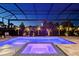 Nighttime view of the lit pool and spa at 7838 Bowspirit Way, Lakewood Ranch, FL 34202