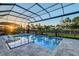 Stunning outdoor pool and spa with sun loungers at 7838 Bowspirit Way, Lakewood Ranch, FL 34202