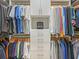 Spacious walk-in closet with abundant storage, wooden hangers, shelving, and drawers for organized apparel at 7838 Bowspirit Way, Lakewood Ranch, FL 34202