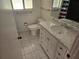 Bathroom featuring a marble vanity and toilet at 8040 Canterbury Cir, Seminole, FL 33777