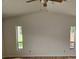 Bedroom with vaulted ceiling, wood floors and ceiling fan at 8040 Canterbury Cir, Seminole, FL 33777