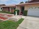 Close-up of charming single-story home with well-manicured lawn and inviting curb appeal at 8040 Canterbury Cir, Seminole, FL 33777
