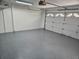 Spacious garage with a neutral painted floor and white garage door at 8040 Canterbury Cir, Seminole, FL 33777