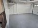 Spacious garage with a neutral painted floor and white garage door at 8040 Canterbury Cir, Seminole, FL 33777