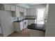 White kitchen with ample counter space and modern appliances at 8040 Canterbury Cir, Seminole, FL 33777