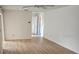 Spacious living room with wood floors and neutral walls at 8040 Canterbury Cir, Seminole, FL 33777