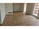 Spacious living room with new flooring, bright windows, and neutral paint at 8040 Canterbury Cir, Seminole, FL 33777