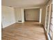 Spacious living room with new flooring, bright windows, and neutral paint at 8040 Canterbury Cir, Seminole, FL 33777