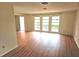 Spacious living room with new flooring, bright windows, and neutral paint at 8040 Canterbury Cir, Seminole, FL 33777