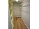 Spacious walk-in closet with ample shelving and wood-look floors at 8040 Canterbury Cir, Seminole, FL 33777