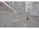 Sleek bathroom featuring a glass-enclosed shower with a bench, and modern fixtures at 805 Padua Ct, Nokomis, FL 34275