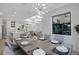 Bright dining area with views of the living spaces and outdoor patio at 805 Padua Ct, Nokomis, FL 34275