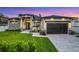 Stunning modern home showcasing stone accents, professional landscaping, and a freshly sealed driveway at 805 Padua Ct, Nokomis, FL 34275