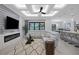 Spacious open-concept living room featuring a fireplace, modern ceiling, and neutral decor at 805 Padua Ct, Nokomis, FL 34275