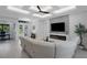 Inviting living room with a modern ceiling design, a fireplace, and adjacent study at 805 Padua Ct, Nokomis, FL 34275