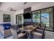 Inviting outdoor dining and living space with a covered patio, perfect for entertaining near the pool at 805 Padua Ct, Nokomis, FL 34275