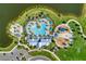 An aerial view showcases a community pool and playground nestled near a lake with verdant lawns at 8940 Royal River Cir, Parrish, FL 34219