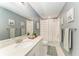 Bathroom featuring a tub and shower combination, a large mirror and modern fixtures at 8940 Royal River Cir, Parrish, FL 34219