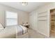 Bedroom with bed, vanity, shelves, and sliding closet doors at 8940 Royal River Cir, Parrish, FL 34219
