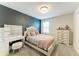 Bedroom featuring a make up vanity, dresser and accent wall at 8940 Royal River Cir, Parrish, FL 34219