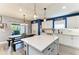 Kitchen with kitchen island, stainless steel appliances, and dining table at 8940 Royal River Cir, Parrish, FL 34219