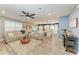 Open-concept living room with modern furnishings, neutral tones, and plenty of natural light at 8940 Royal River Cir, Parrish, FL 34219