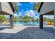 Resort style community pool featuring clear blue water and plenty of lounge chairs at 8940 Royal River Cir, Parrish, FL 34219