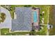 Aerial view of a private backyard pool, with a screened enclosure, adjacent to a boat dock at 965 E Gondola Dr, Venice, FL 34293