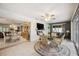 Bright dining area featuring view into living room and access to pool area at 965 E Gondola Dr, Venice, FL 34293