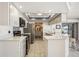 Modern kitchen with white countertops, stainless steel appliances, and ample cabinet space for storage and food prep at 965 E Gondola Dr, Venice, FL 34293